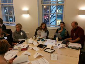 A picture of a live bespoke training CAP course with a group of learners sitting around a table